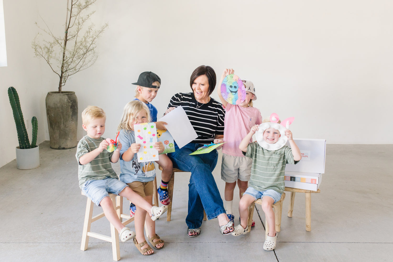 My Little Playschool founder Ms. Kristen and excited children with their crafts